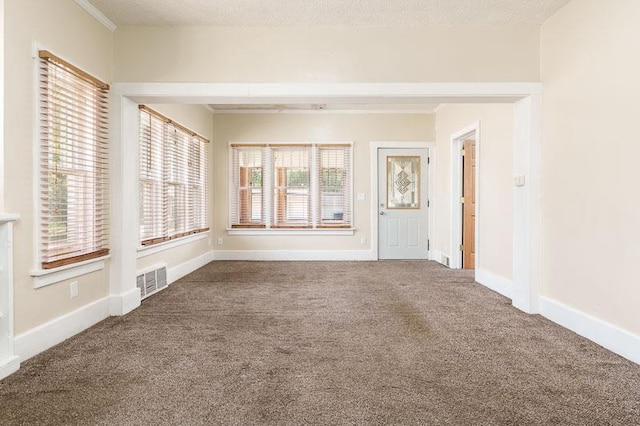 619 Middle St, Beloit, WI 53511 - unfurnished living room featuring carpet floors and ornamental molding