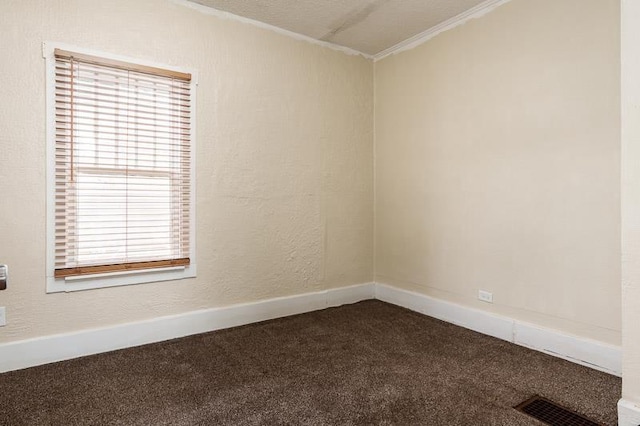 619 Middle St, Beloit, WI 53511 - empty room featuring dark carpet, plenty of natural light, and crown molding