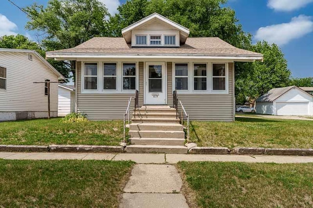 619 Middle St, Beloit, WI 53511 - bungalow-style home with a front yard and entry steps