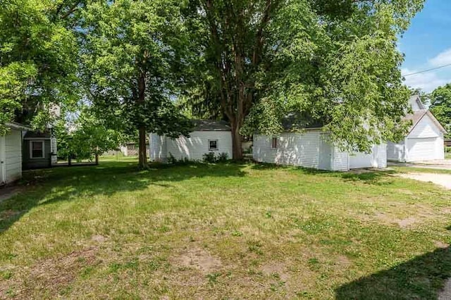 619 Middle St, Beloit, WI 53511 - view of green lawn featuring an outbuilding