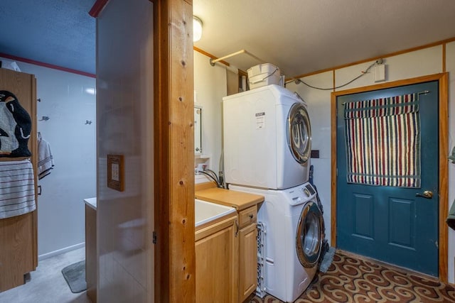 N8981 W Island Rd, Phillips, WI 54555 - washroom featuring stacked washing machine and dryer and cabinet space