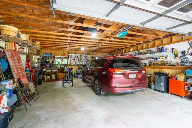 N8981 W Island Rd, Phillips, WI 54555 - garage with a workshop area and a garage door opener