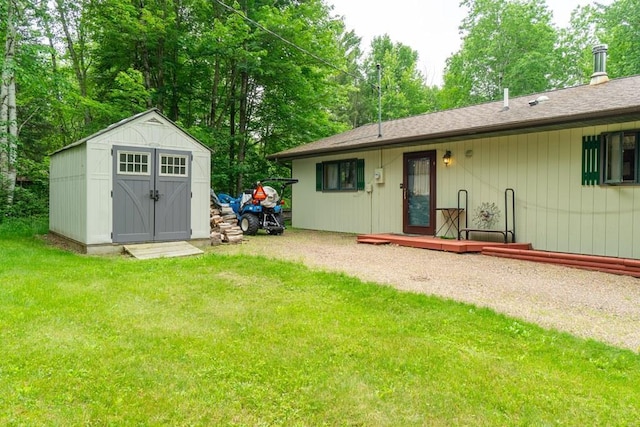 N8981 W Island Rd, Phillips, WI 54555 - view of grassy yard with a storage shed and view of wooded area