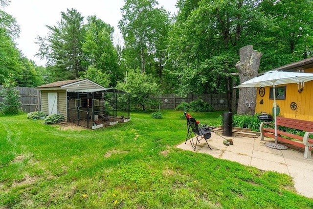 N8981 W Island Rd, Phillips, WI 54555 - fenced backyard featuring an outdoor structure and view of wooded area