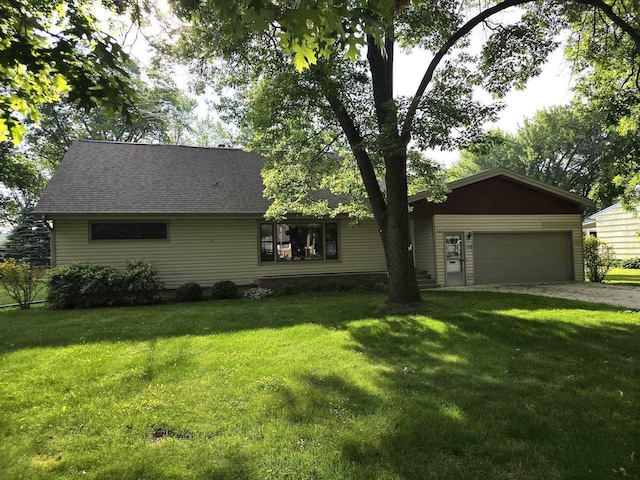1440 4th St, Port Edwards, WI 54469 - view of front of property featuring a garage, driveway, a front lawn, and a shingled roof