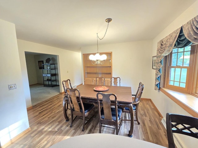 1440 4th St, Port Edwards, WI 54469 - dining area featuring a chandelier and wood finished floors