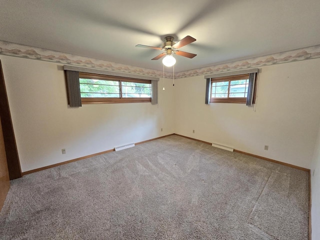 1440 4th St, Port Edwards, WI 54469 - spare room featuring a ceiling fan and light colored carpet