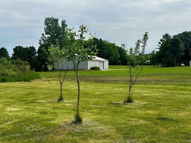 7376 Neils Rd, Sturgeon Bay, WI 54235 - view of green lawn with an outbuilding and a detached garage