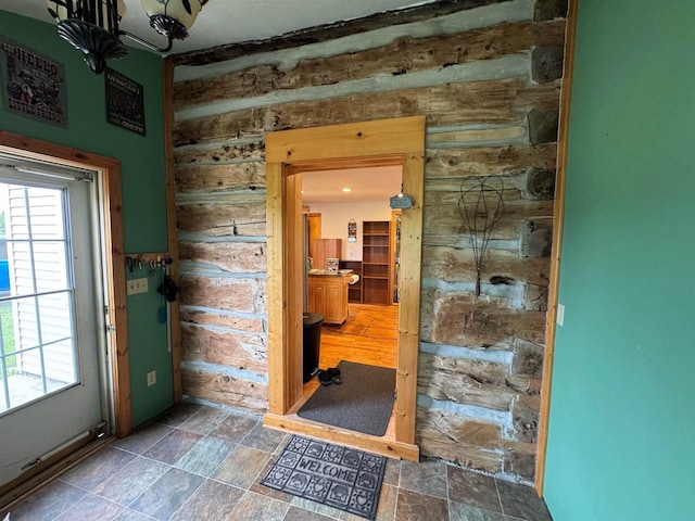 7376 Neils Rd, Sturgeon Bay, WI 54235 - entryway featuring stone finish flooring and wood walls