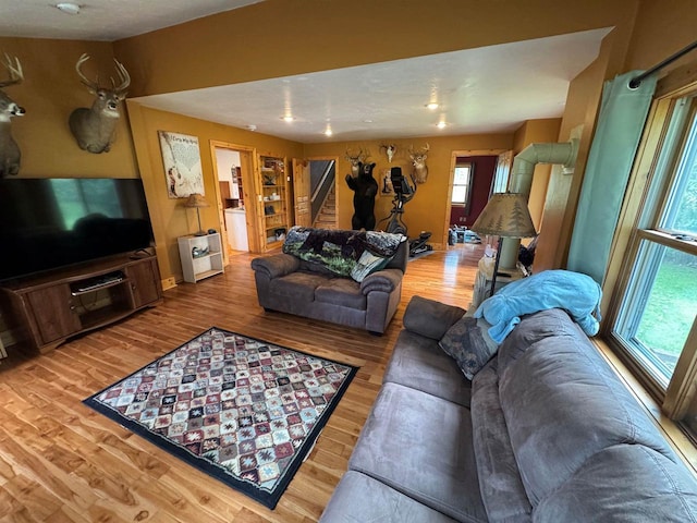 7376 Neils Rd, Sturgeon Bay, WI 54235 - living area with healthy amount of natural light, stairway, and wood finished floors
