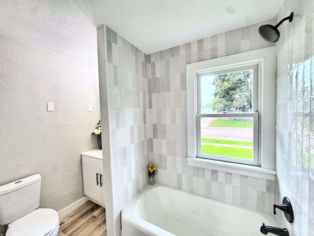 985 Higgins Ave, Neenah, WI 54956 - bathroom featuring a tub to relax in, wood finished floors, a shower, and vanity