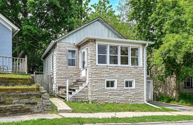 1721 Spring Pl, Racine, WI 53404 - view of front of house featuring stone siding and board and batten siding