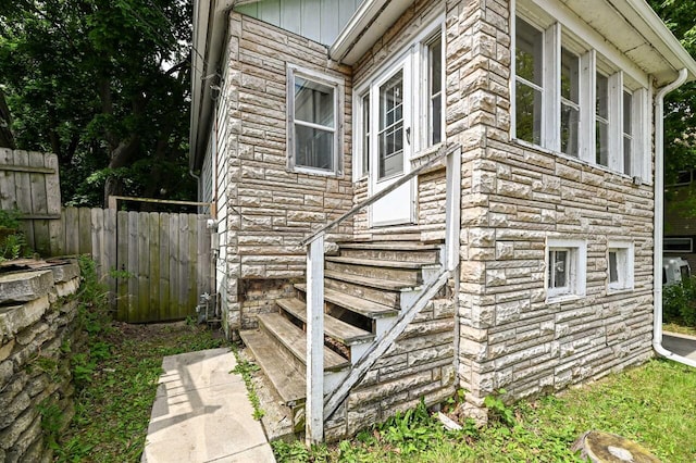 1721 Spring Pl, Racine, WI 53404 - view of side of property featuring stone siding and entry steps
