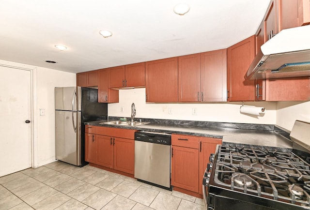 1721 Spring Pl, Racine, WI 53404 - kitchen with stainless steel appliances, exhaust hood, dark countertops, brown cabinetry, and light tile patterned floors