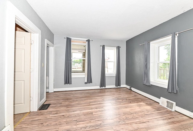 1721 Spring Pl, Racine, WI 53404 - empty room featuring wood finished floors and baseboards