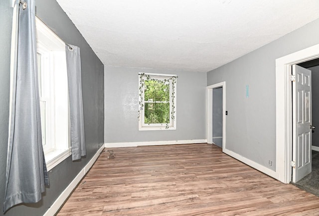 1721 Spring Pl, Racine, WI 53404 - empty room featuring wood finished floors and a textured ceiling