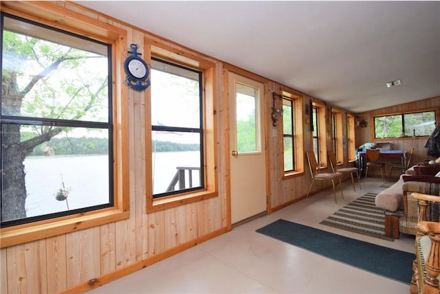 3777 N Deer Lake Dr, Danbury, WI 54830 - sunroom featuring wooden walls, a water view, and lofted ceiling