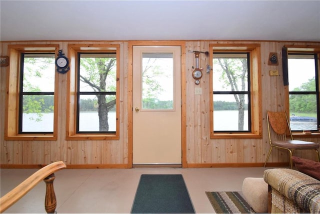 3777 N Deer Lake Dr, Danbury, WI 54830 - doorway with wooden walls, healthy amount of natural light, and a water view