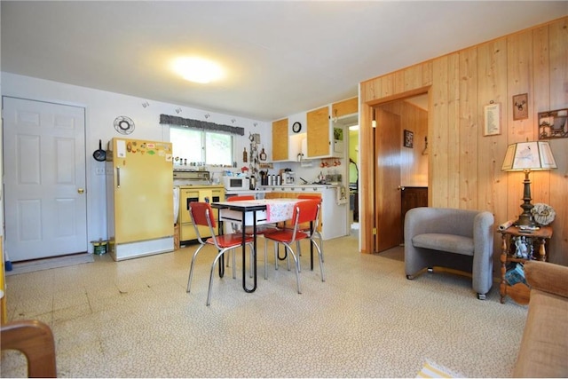 3777 N Deer Lake Dr, Danbury, WI 54830 - dining space featuring wood walls and light floors