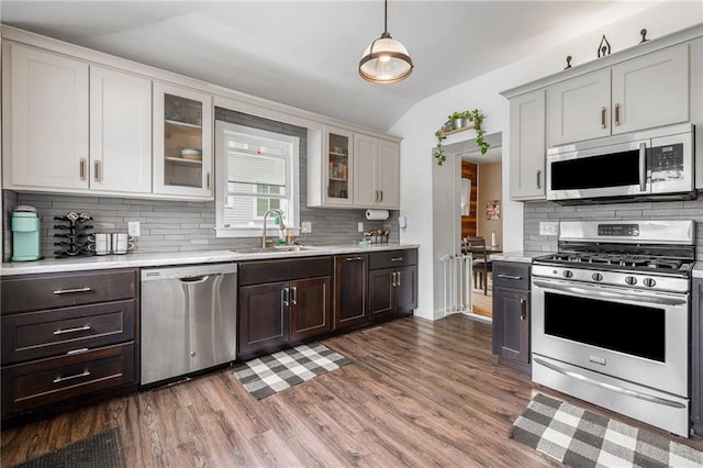 508 Evergreen St, Colfax, WI 54730 - kitchen with appliances with stainless steel finishes, light countertops, vaulted ceiling, and tasteful backsplash