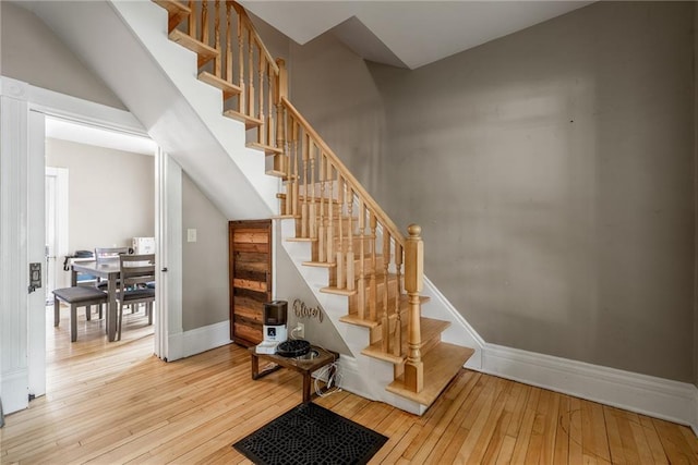 508 Evergreen St, Colfax, WI 54730 - stairs featuring hardwood / wood-style floors and baseboards