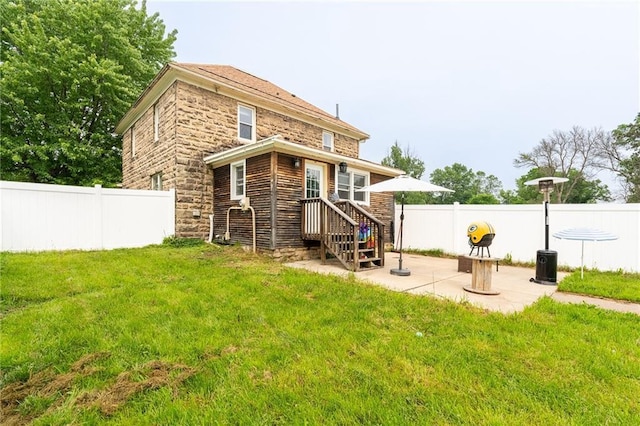 508 Evergreen St, Colfax, WI 54730 - back of house featuring a patio and stone siding