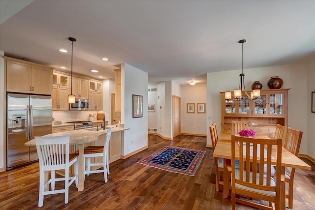 8201 Highview Dr, Madison, WI 53719 - dining space featuring dark wood finished floors, a chandelier, and recessed lighting