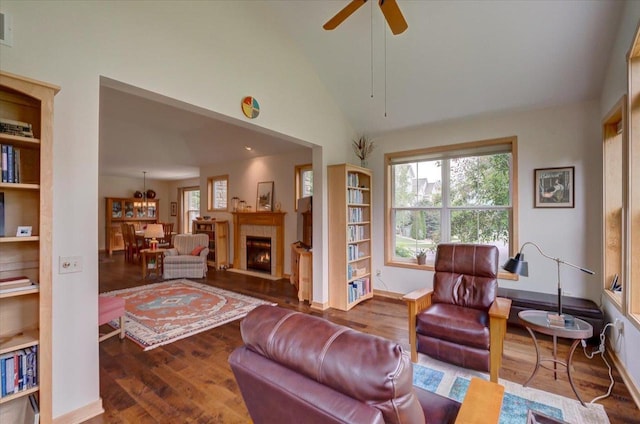 8201 Highview Dr, Madison, WI 53719 - living area with wood finished floors, healthy amount of natural light, ceiling fan, lofted ceiling, and a fireplace