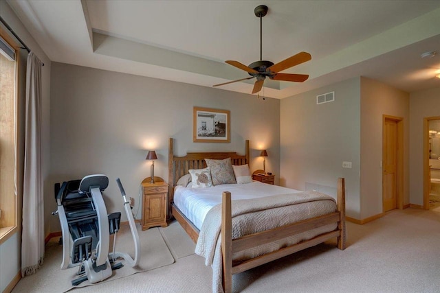 8201 Highview Dr, Madison, WI 53719 - bedroom with light colored carpet, a ceiling fan, and a tray ceiling