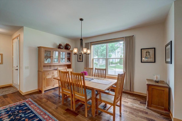 8201 Highview Dr, Madison, WI 53719 - dining space with dark wood finished floors and a chandelier