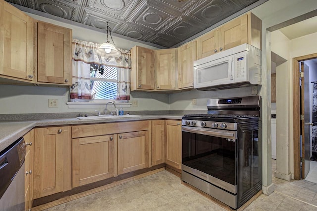 66 Torrey St, Clintonville, WI 54929 - kitchen featuring appliances with stainless steel finishes, light brown cabinetry, and an ornate ceiling