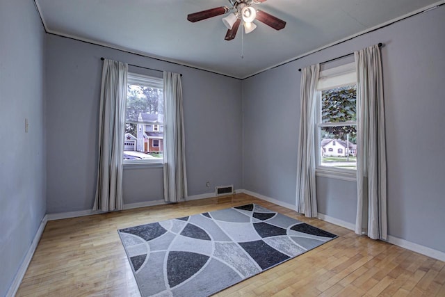 66 Torrey St, Clintonville, WI 54929 - spare room with healthy amount of natural light, wood finished floors, and a ceiling fan