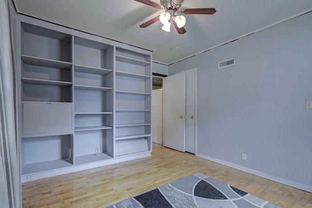 66 Torrey St, Clintonville, WI 54929 - unfurnished bedroom with wood finished floors and ceiling fan