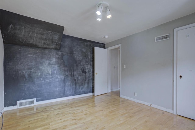 66 Torrey St, Clintonville, WI 54929 - empty room with wood finished floors and baseboards