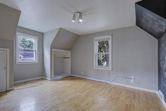 66 Torrey St, Clintonville, WI 54929 - additional living space with lofted ceiling and hardwood / wood-style floors