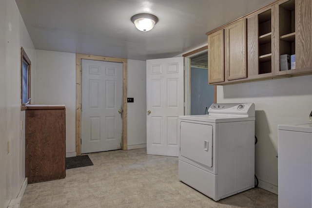 66 Torrey St, Clintonville, WI 54929 - washroom featuring washing machine and clothes dryer, cabinet space, and light floors