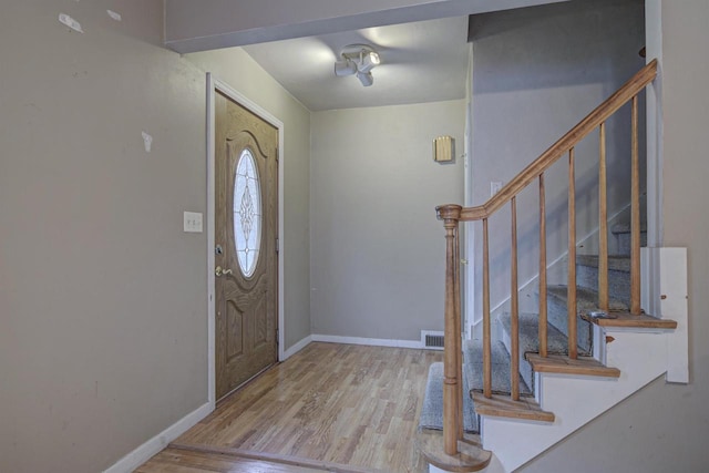 66 Torrey St, Clintonville, WI 54929 - foyer entrance featuring wood finished floors and stairway
