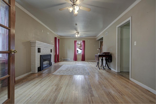 66 Torrey St, Clintonville, WI 54929 - unfurnished living room with ceiling fan, hardwood / wood-style flooring, a fireplace, and crown molding
