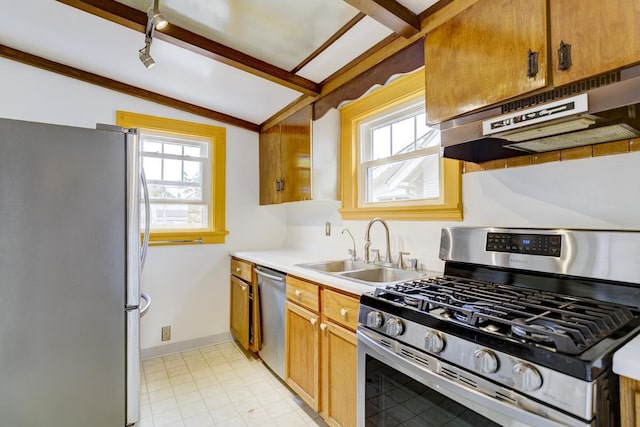 518 Maple Ave, Madison, WI 53704 - kitchen with appliances with stainless steel finishes, under cabinet range hood, light countertops, and brown cabinets
