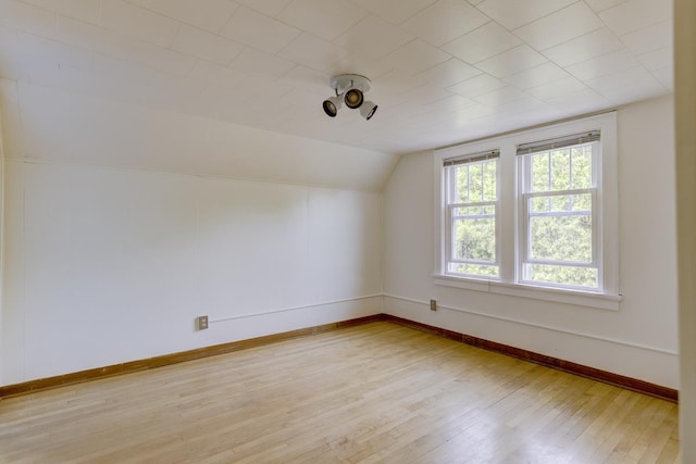 518 Maple Ave, Madison, WI 53704 - unfurnished room with lofted ceiling and light wood-style floors