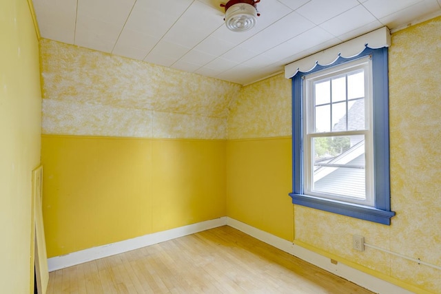 518 Maple Ave, Madison, WI 53704 - empty room featuring wood finished floors and wallpapered walls