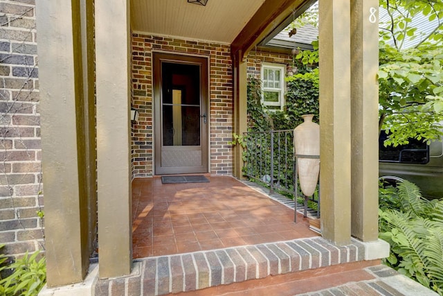 518 Maple Ave, Madison, WI 53704 - view of exterior entry with brick siding and covered porch