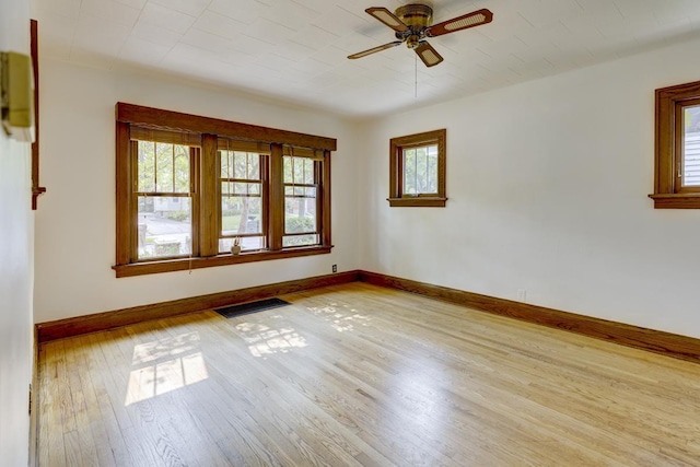 518 Maple Ave, Madison, WI 53704 - empty room with healthy amount of natural light, wood-type flooring, and a ceiling fan