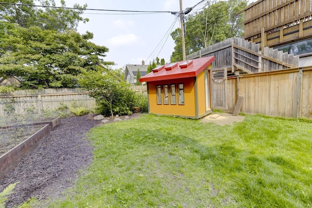 518 Maple Ave, Madison, WI 53704 - fenced backyard featuring an outbuilding and a vegetable garden