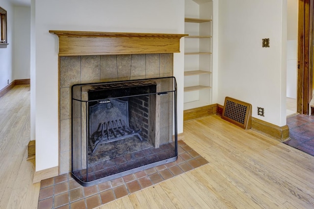 518 Maple Ave, Madison, WI 53704 - detailed view of a tiled fireplace and wood finished floors