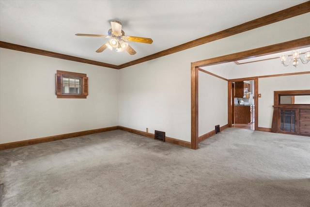 2140 N 64th St, Wauwatosa, WI 53213 - carpeted empty room featuring ornamental molding, a ceiling fan, and a chandelier