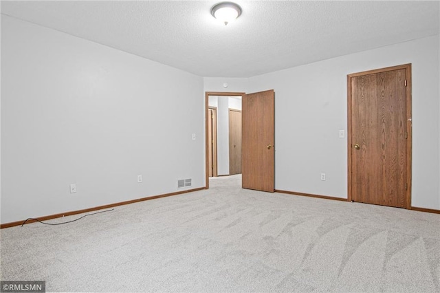 1754 Helena Rd, Oakdale, MN 55128 - unfurnished bedroom with carpet floors and a textured ceiling
