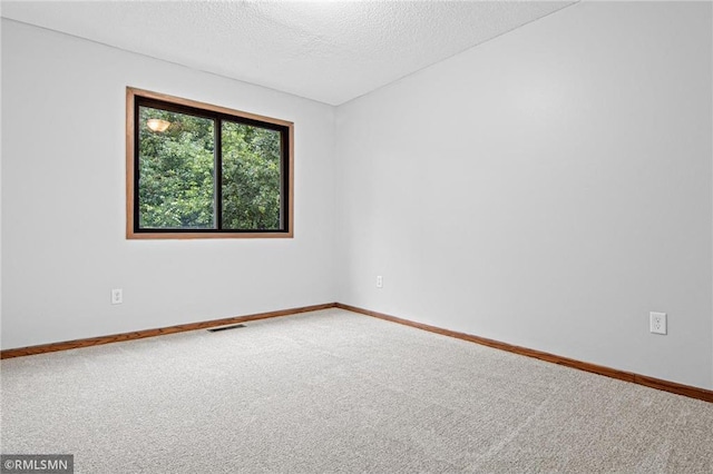 1754 Helena Rd, Oakdale, MN 55128 - carpeted empty room featuring a textured ceiling and baseboards