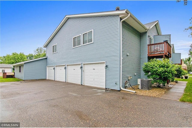 1754 Helena Rd, Oakdale, MN 55128 - view of home's exterior with asphalt driveway and an attached garage