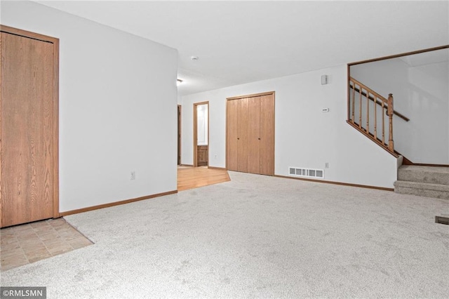 1754 Helena Rd, Oakdale, MN 55128 - unfurnished living room with carpet floors and stairs